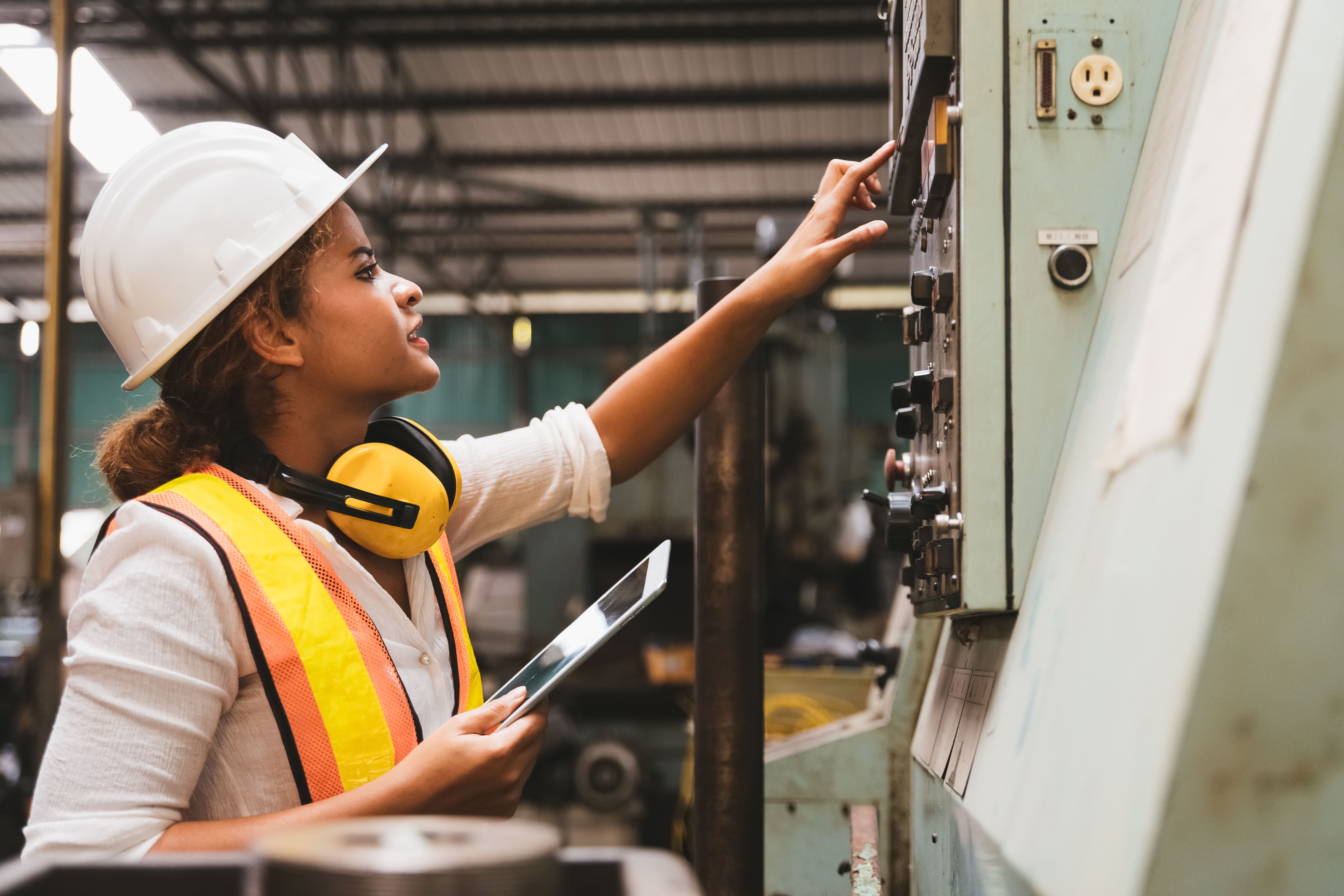 maintenance technician checking preventive maintenance plan