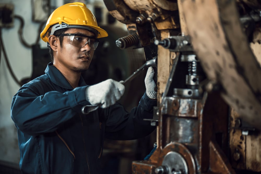 maintenance technician performing a preventive maintenance task