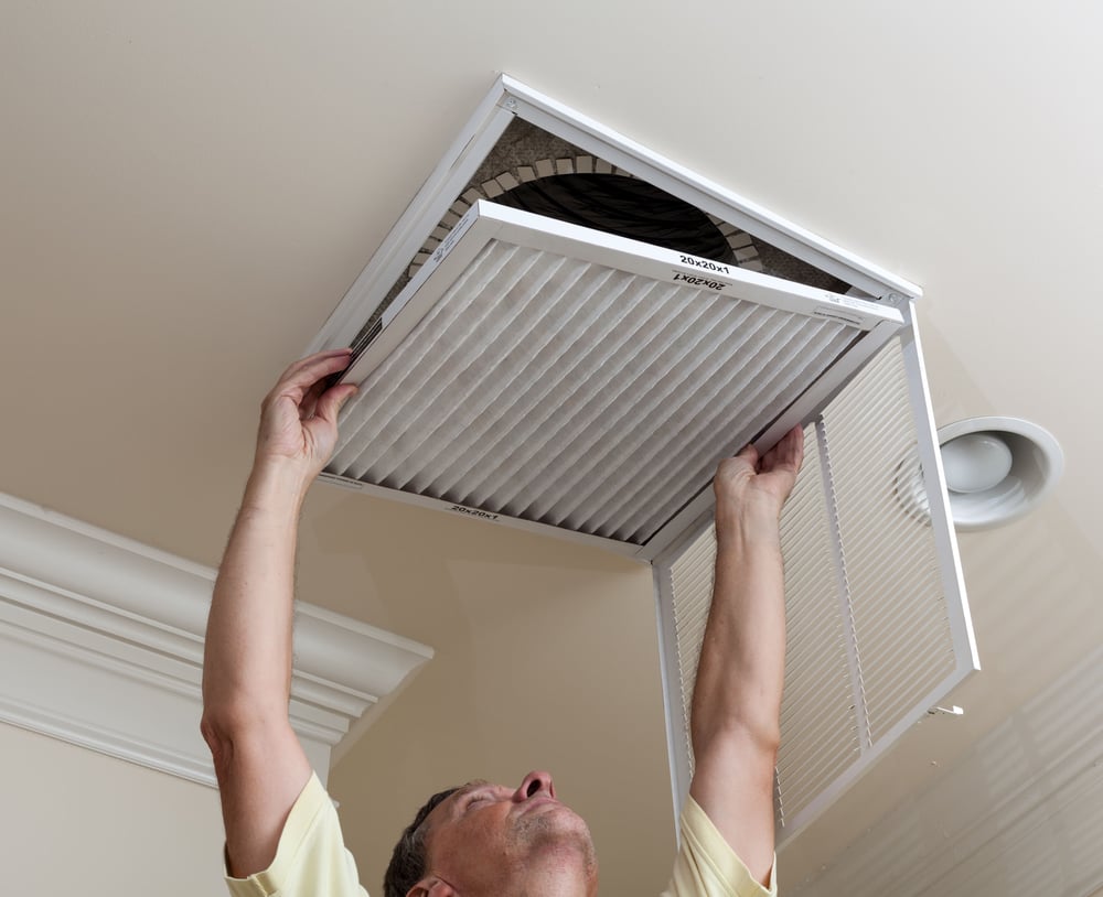 maintenance manager checking AC filters