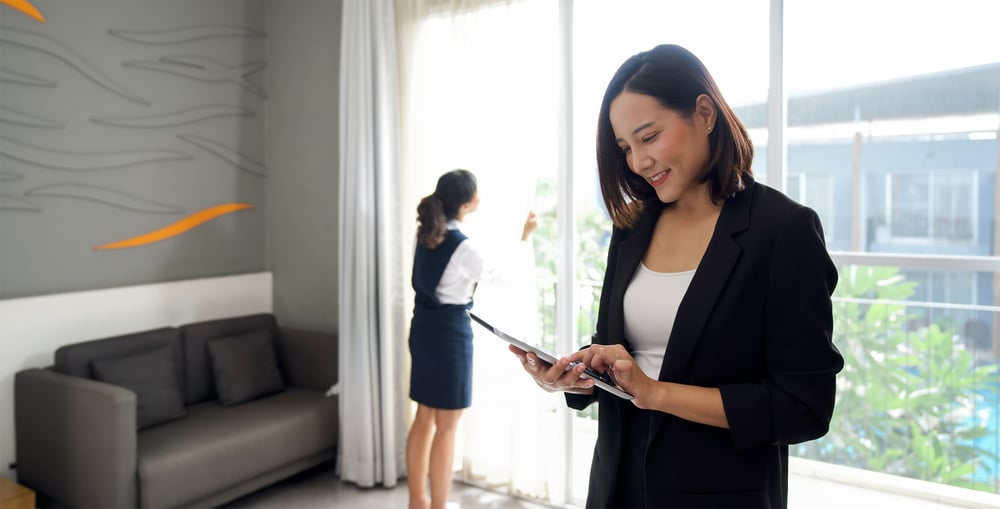 hotel manager checking her device