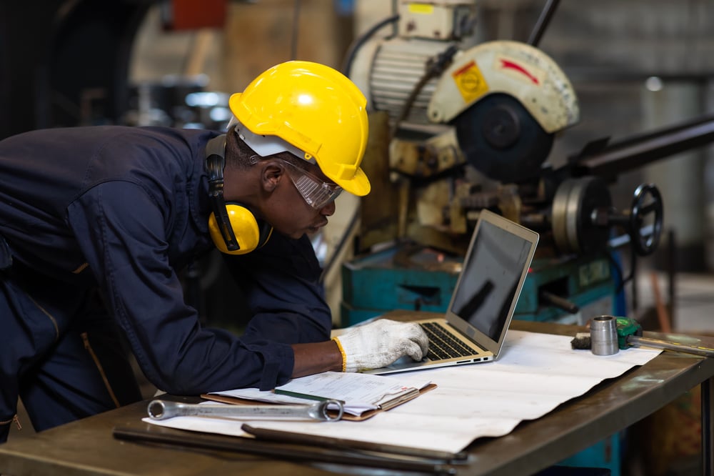 maintenance professional checking his laptop