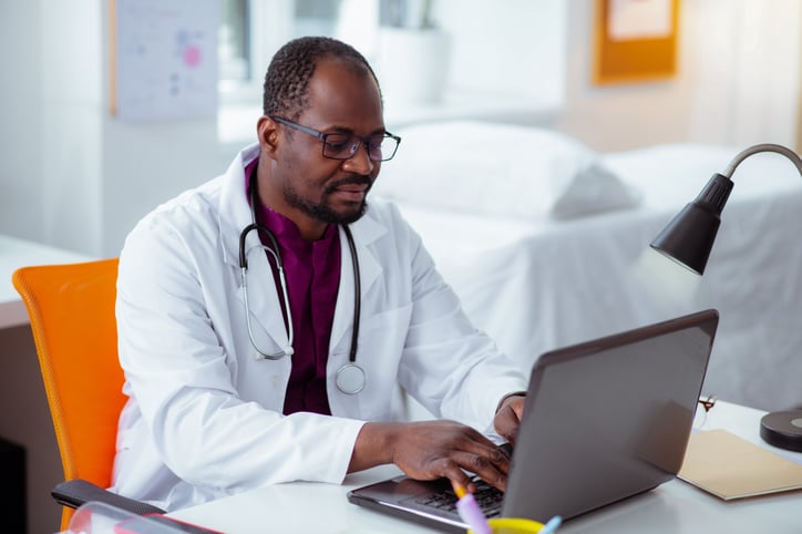 Doctor viewing cmms software and its robust reporting capabilities