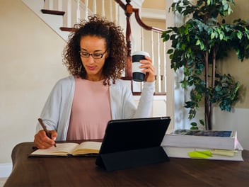 woman watching demo online of property maintenance management software to streamline maintenance tasks and asset management