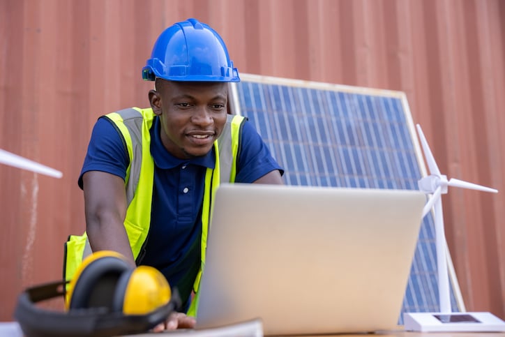 maintenance worker looking over key maintenance metrics