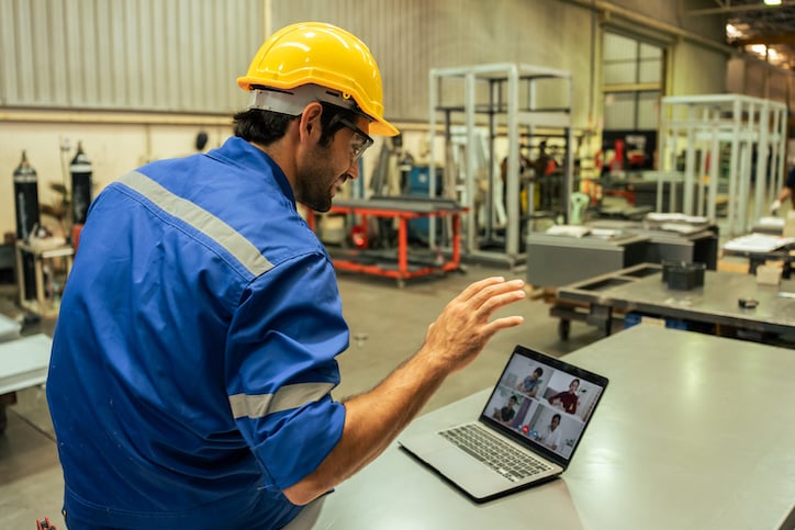 manager talking to worker about how to track maintenance kpis