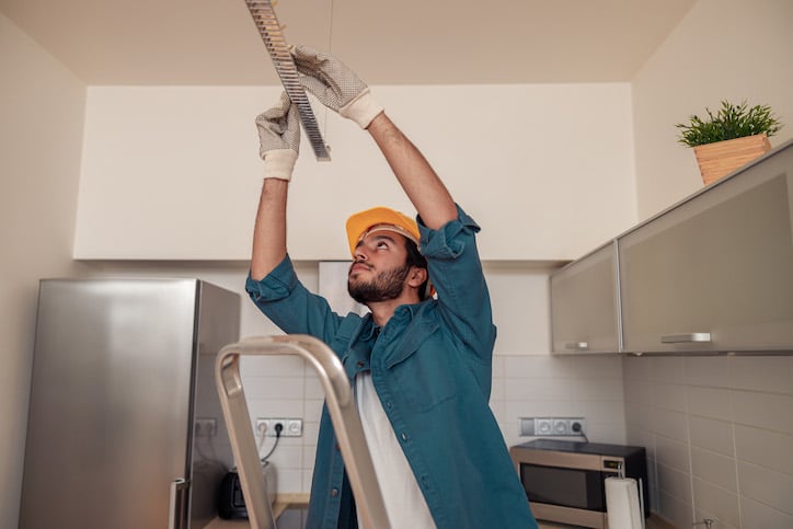 maintenance worker conducting equipment maintenance after work requests through the company CMMS