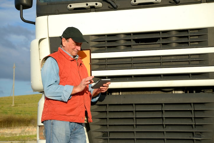 maintenance worker utilizing facility management apps on mobile devices for the team which can help you track all your tasks