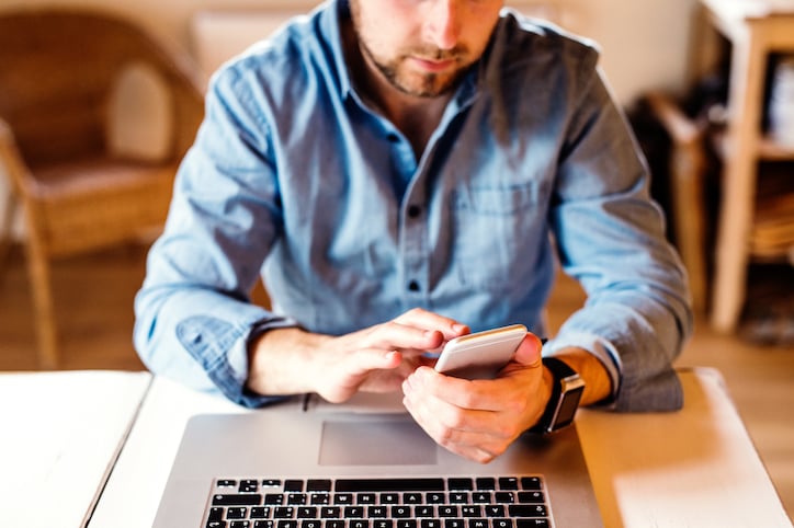 man holding maintenance schedules and key performance indicators for tasks completed