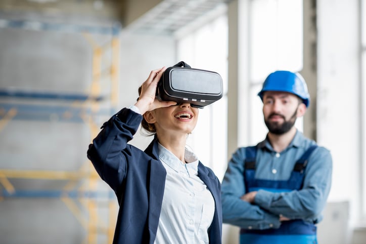 woman using sensor data and machine learning to view building construction through a VR device