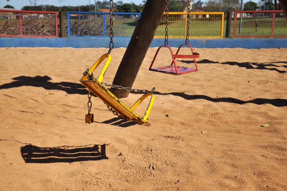 Broken swing in school needs maintenance