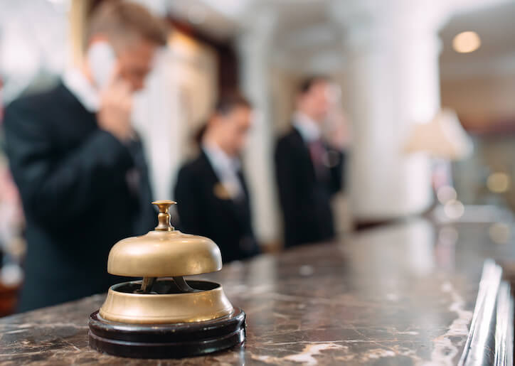 front desk staff assigning automated room assignments to maintenance department to improve guest satisfaction