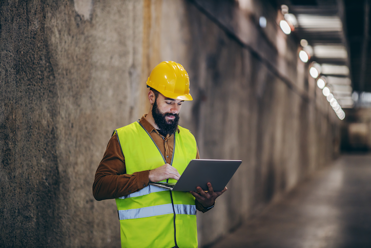 a maintenance worker utilizing a computerized maintenance management system as an online document storage solution